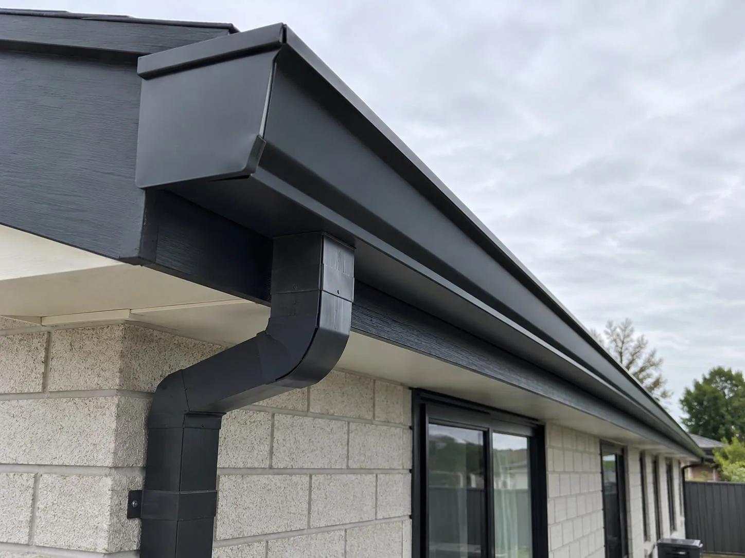 Roof repair work on an Auckland home with internal gutters