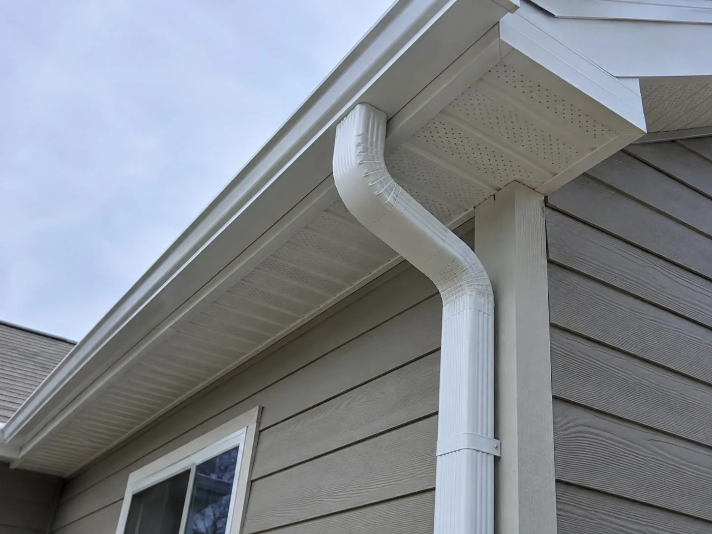 West Auckland roofing contractors installing gutters and downpipes