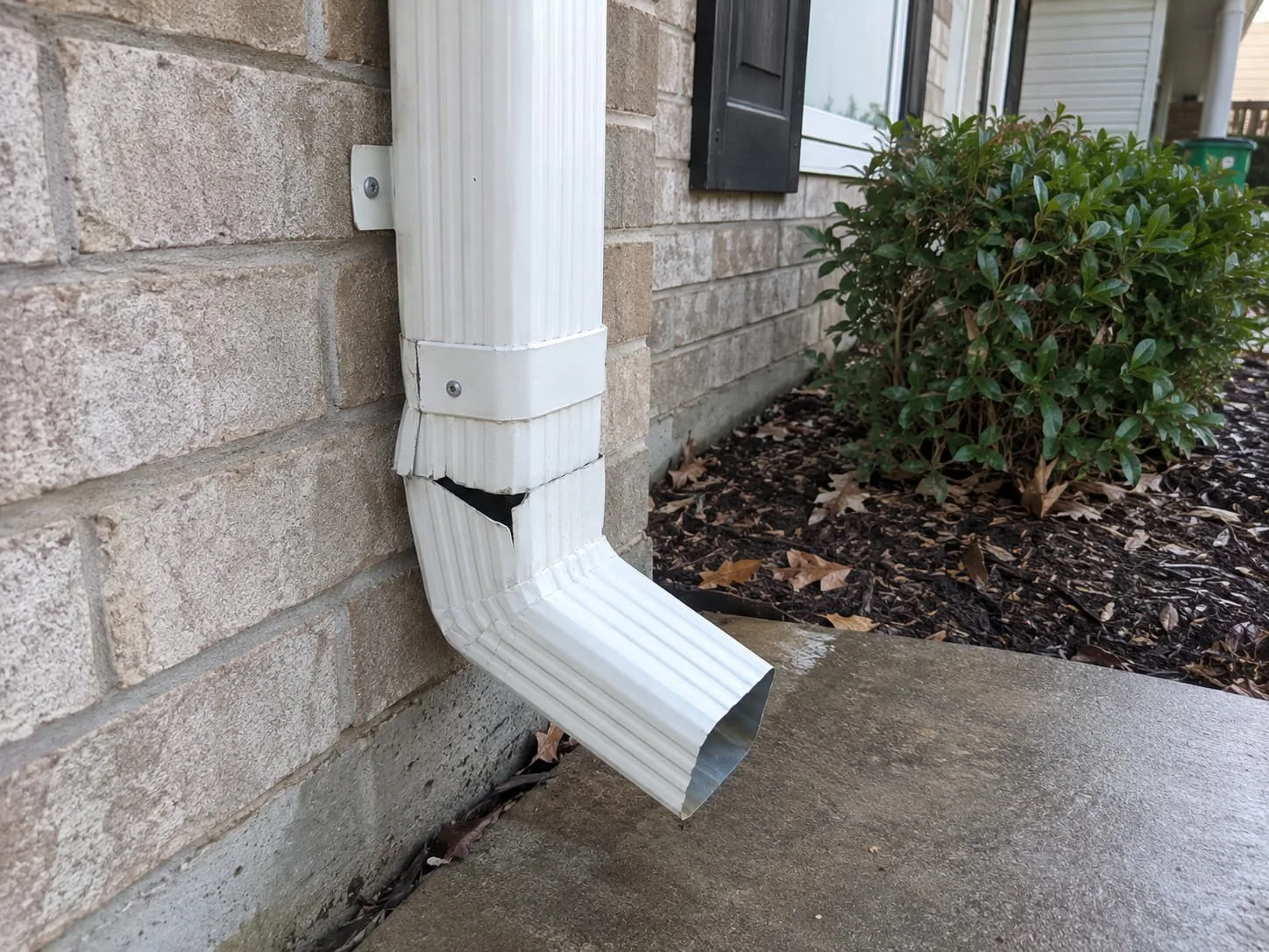 Roofing team repairing gutters and downpipes in West Auckland