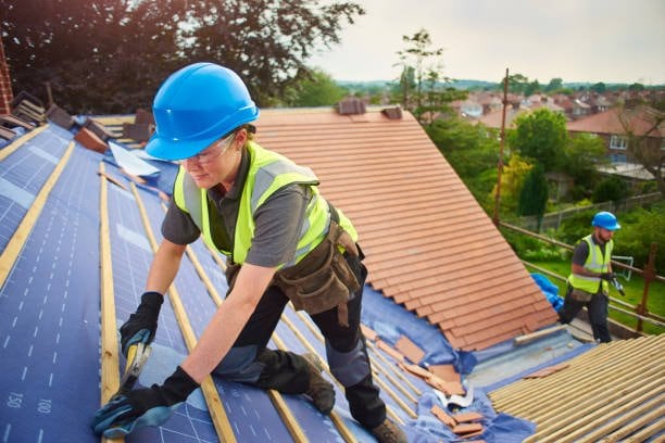Roofers working on a residential roof