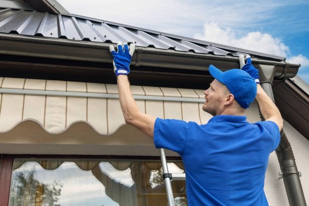 Gutter replacement work on a residential home